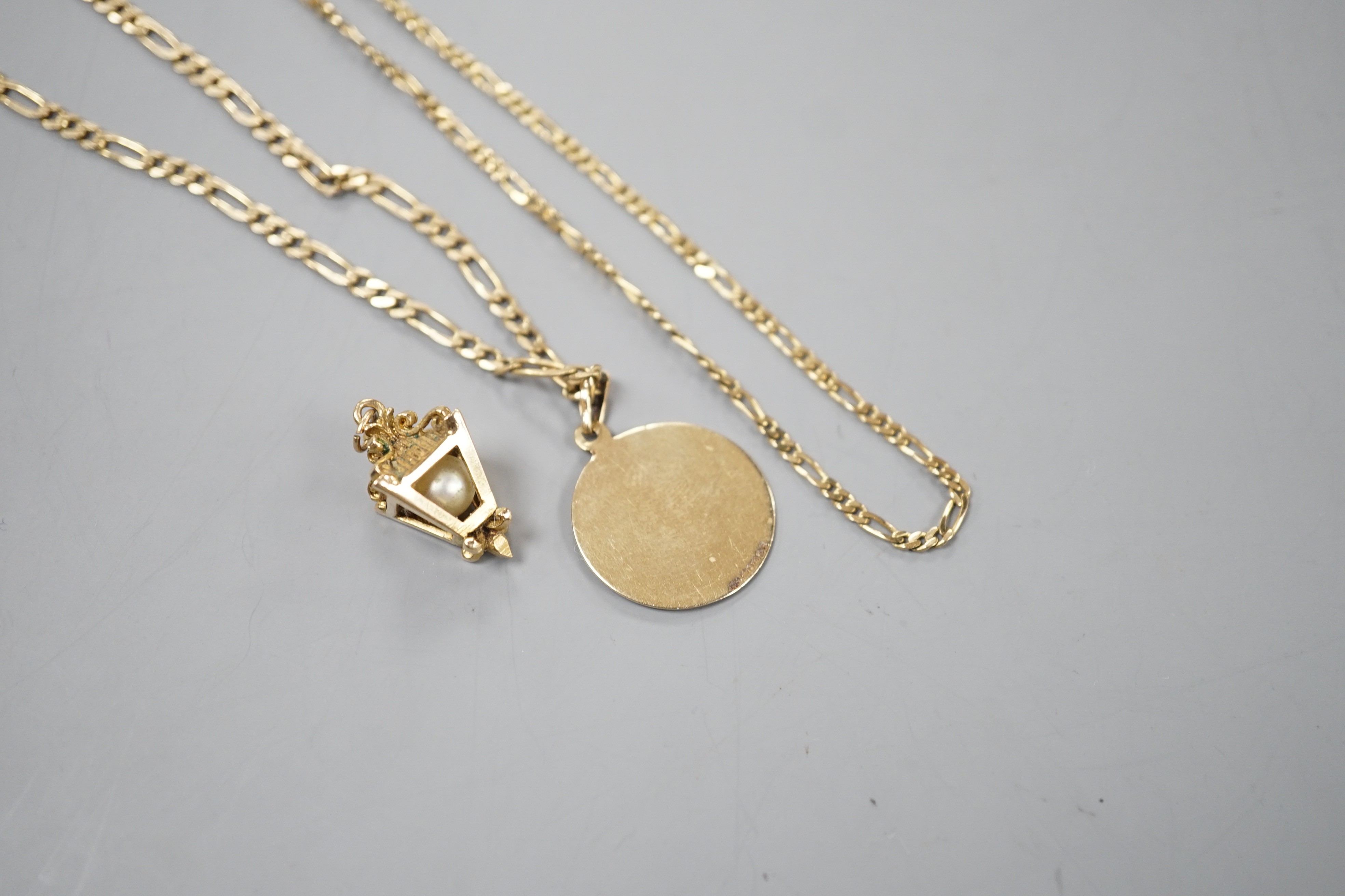 A modern 9ct gold chain with lantern pendant and a 9ct chain with 9ct circular pendant, gross 16.9 grams.